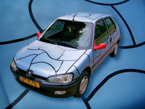 Not pimped but funky nevertheless // ca. 2 x 3 x 1,5 m // spray paint on car // 2006 // 8670 views